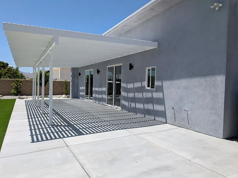 HUGE covered patio runs the entire length of the house