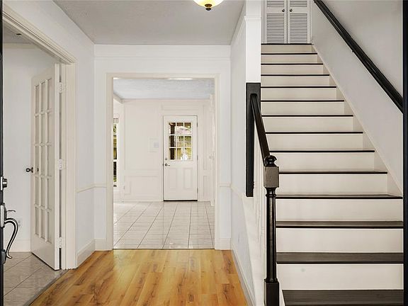 Welcome! Let side through French Doors is the Study or Game Room, to the right of the stairs you will soon see the Formal Dining Room.