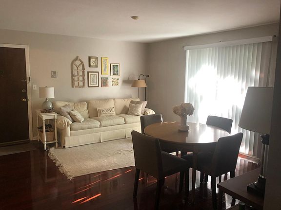 Open concept living area with slider to private balcony
