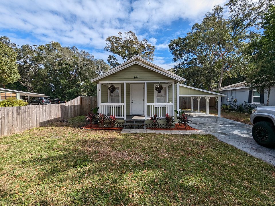 Nestled in Oak trees on a red brick road