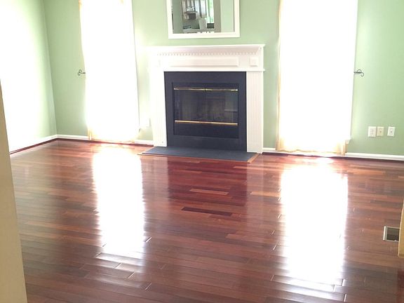 Bright living room with wood burning fireplace