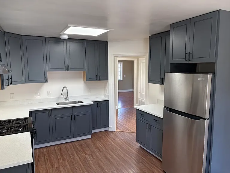 Plenty of cabinets; new flooring; no dishwasher
