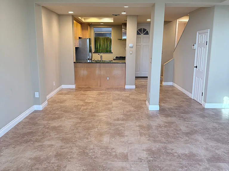 View from living room into kitchen, recessed lighting