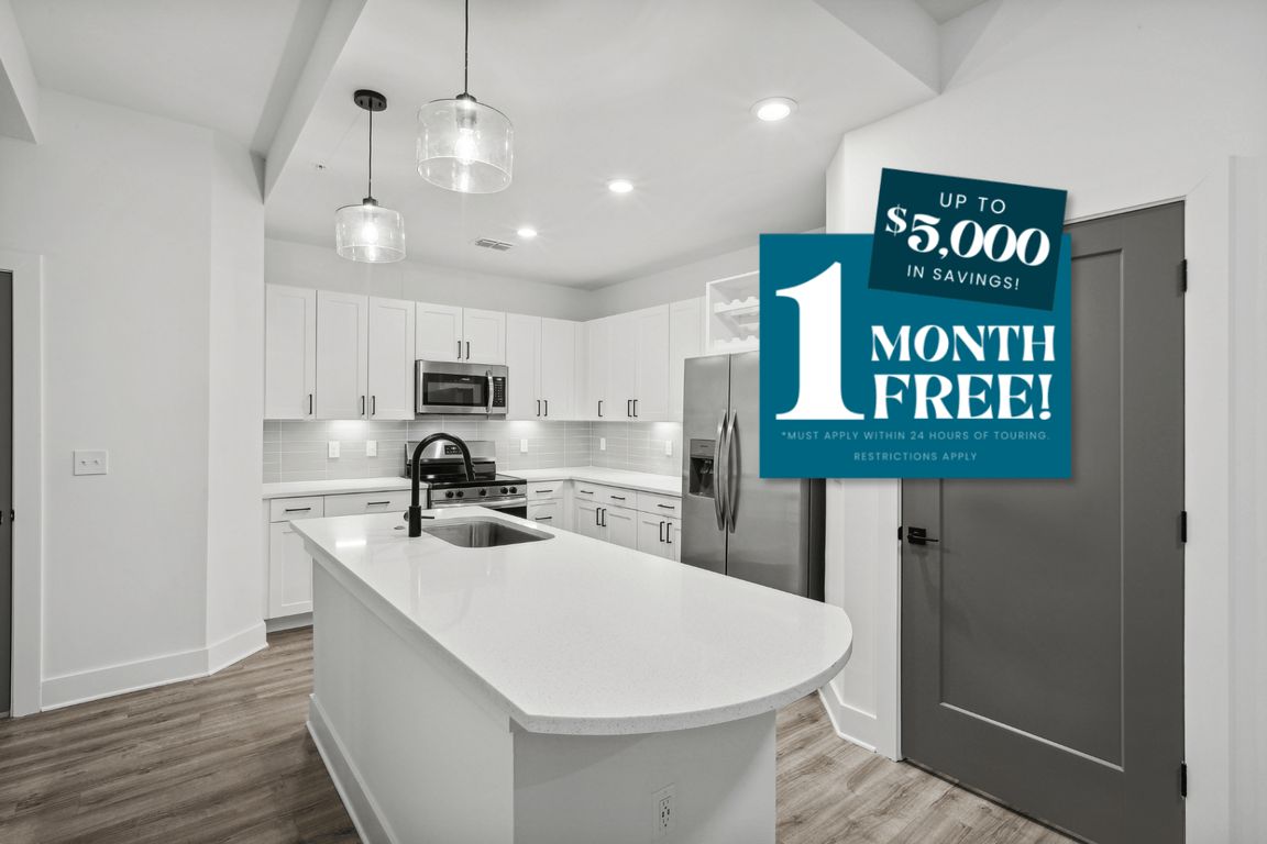 Kitchen with Quartz Countertop and Stainless Steel Appliances