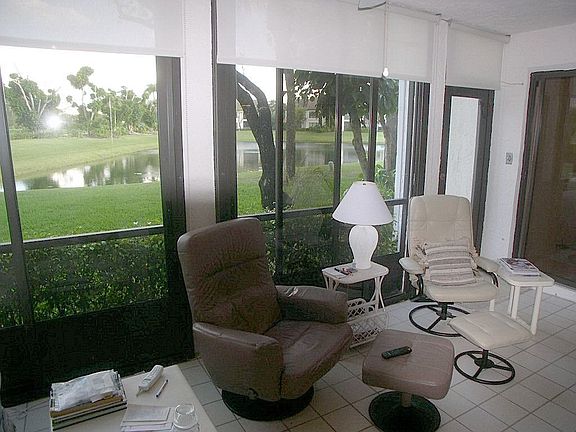 Sliding glass door patio on pond.