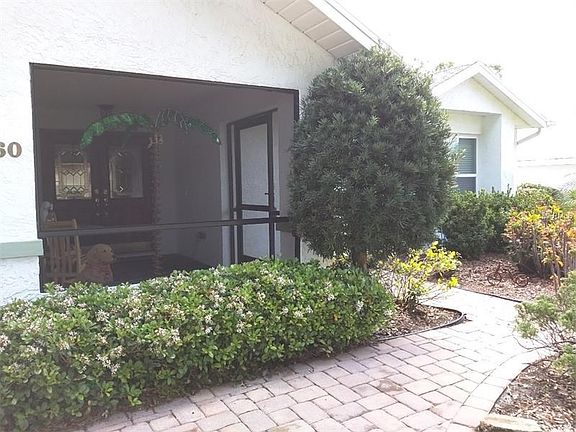 Paver walkway to the screen porch entry