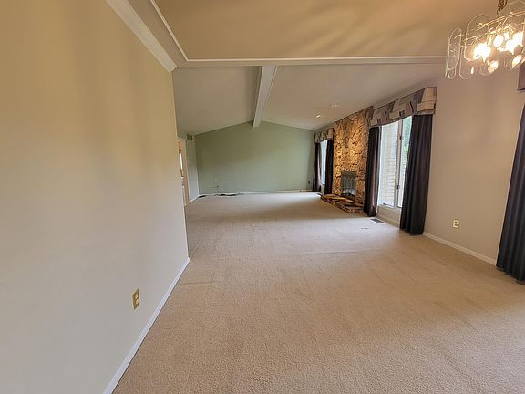 Looking into the living and combined Family room from the dining/Kitchen. Very open. (see next photo for refreshed paint)