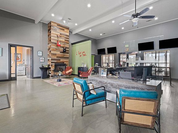Stylish Community Lounge with Fireplace at Ovation Apartments in Austin, TX
