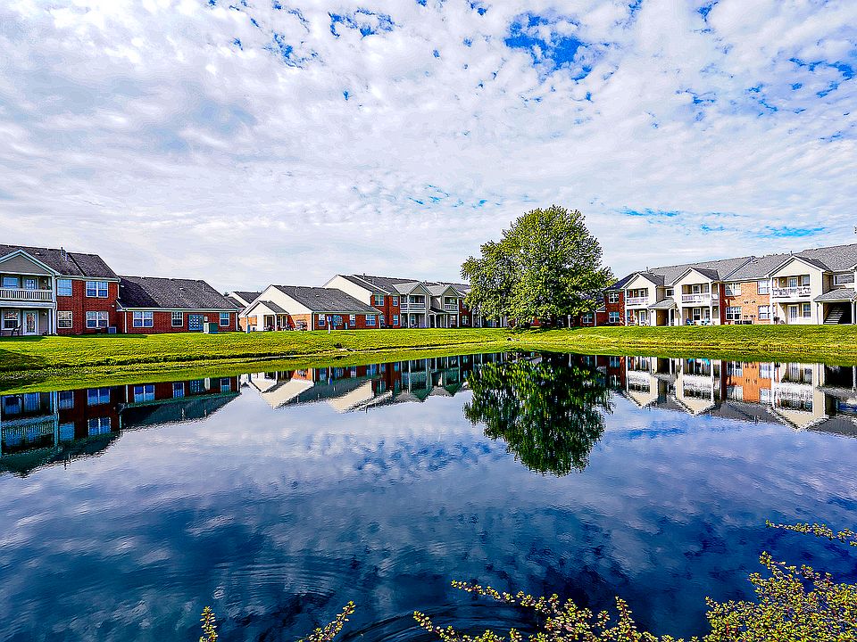 Tranquility built in. The pond at Hamilton Station reflects blue skies and calm mornings_just one more reason it feels good to come home.