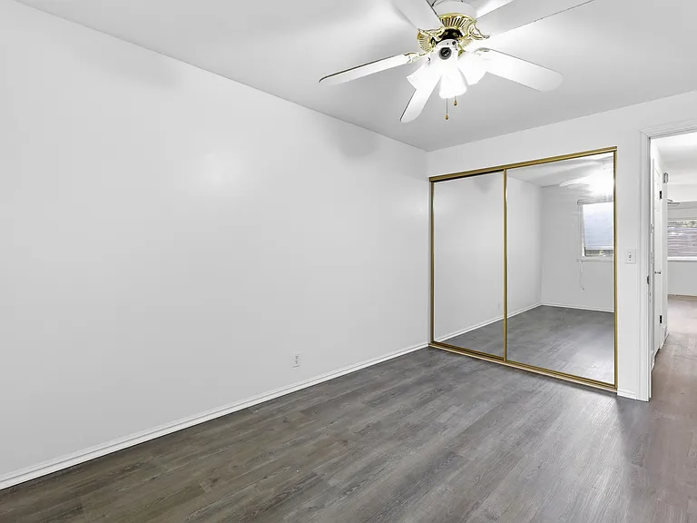 Bedroom #2 with new paint and LVP flooring