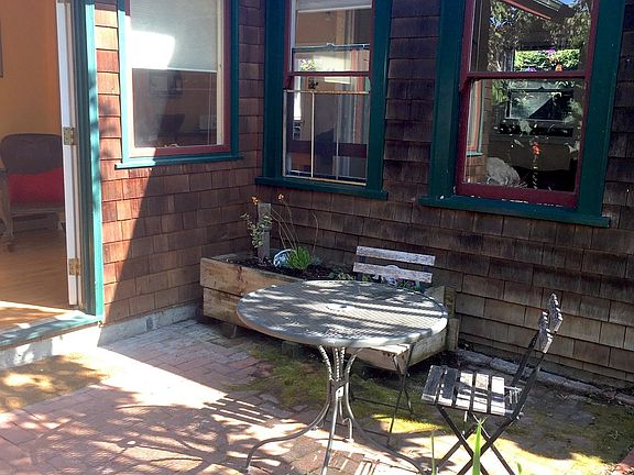 Small private patio with table and chairs