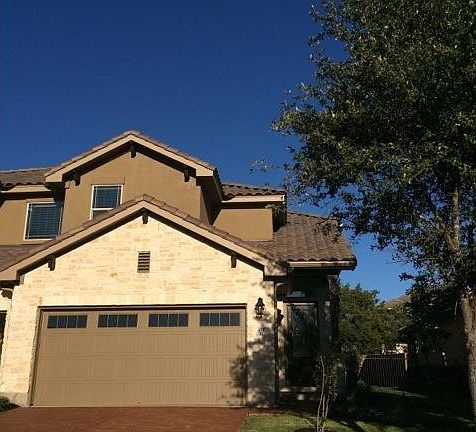 stained concrete driveway and beautiful entry. (left side)