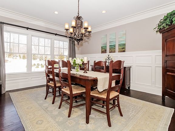 Dining room with wainscoting and access to Butler's pantry