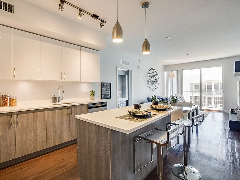 Kitchen islands featuring designer two-tone cabinetry for cooking, dining and entertaining