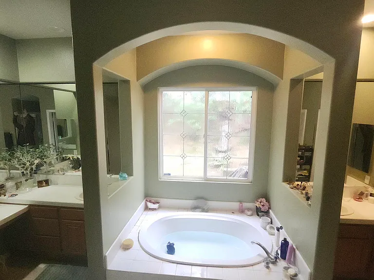 Double sinks and a beautiful soaking bath tub.