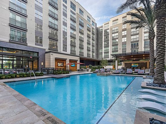 Resort-style pool with palm trees