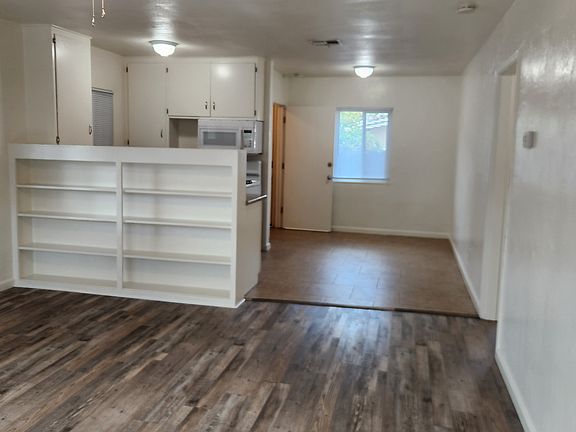 View of living room and dining room from front door