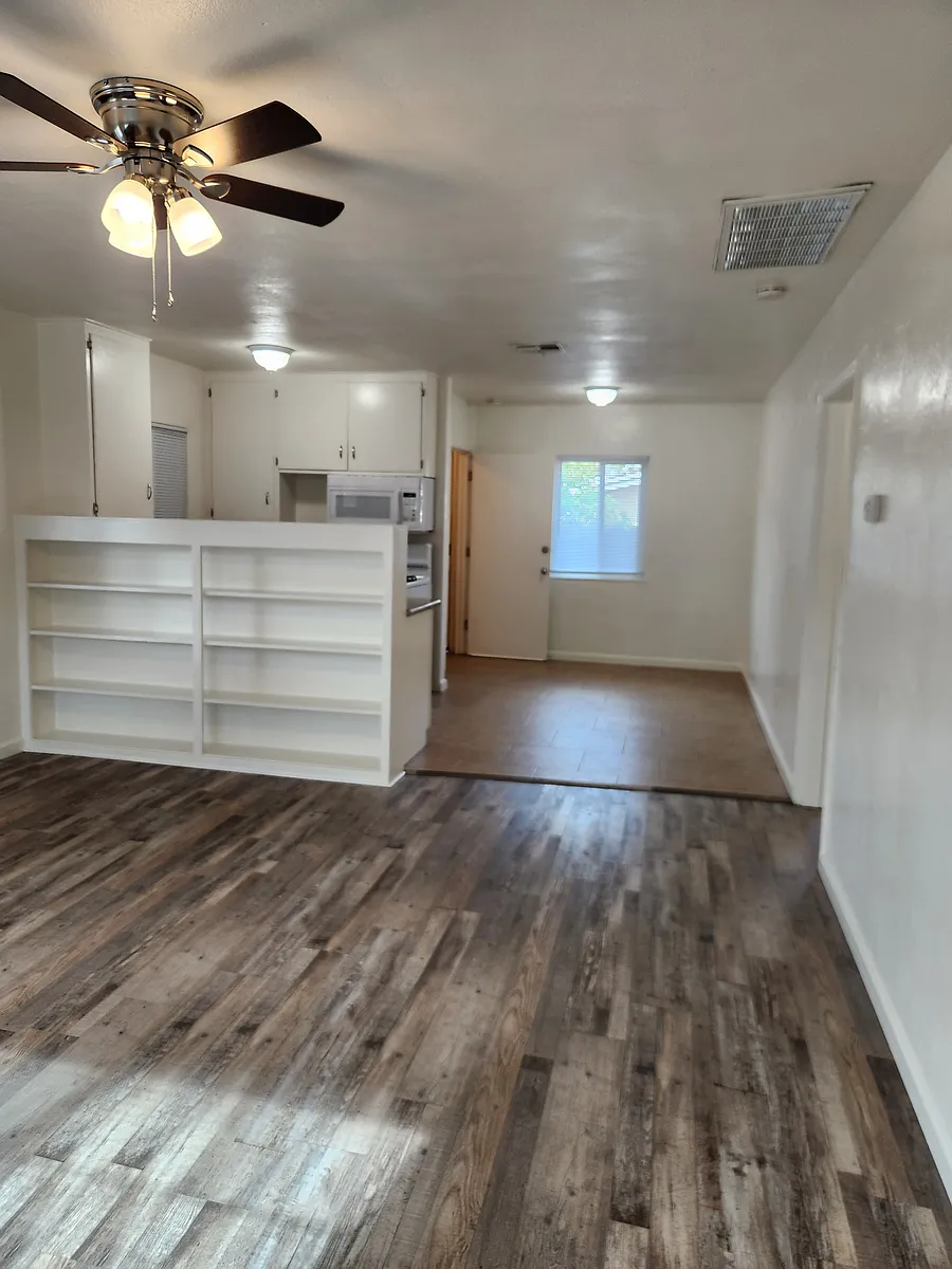 View of living room and dining room from front door - 300 W Tulare Ave