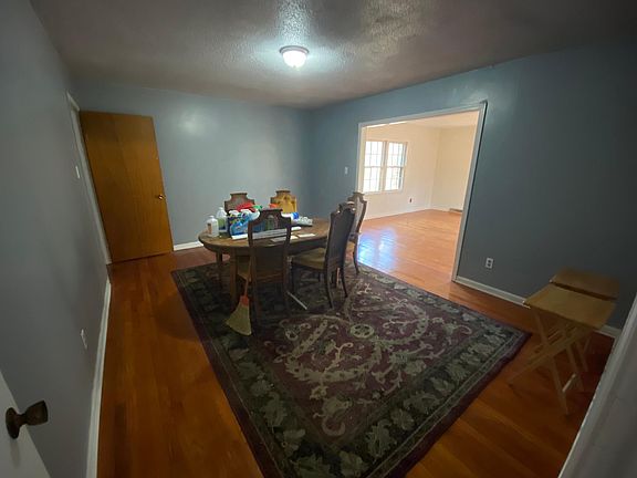 Den (Middle of house-near Kitchen to the left & Hallway to the right) also leading into the Sun Room.