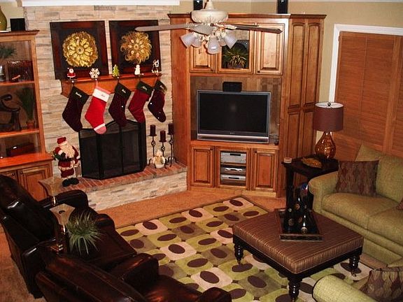 Den opens to kitchen.