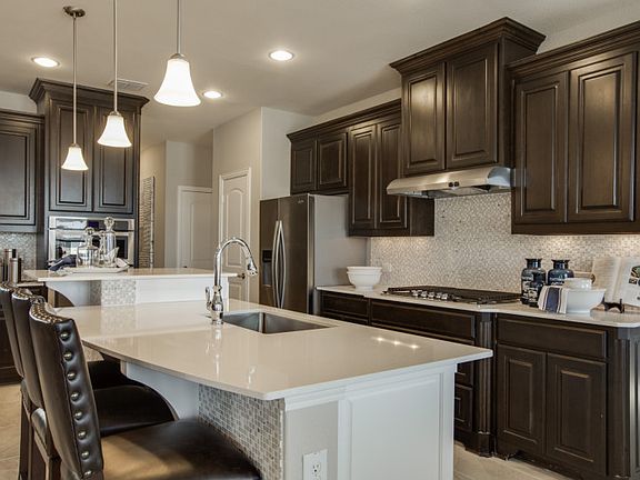 Island kitchen with eat-in bartop, with your choice of granite or quartz countertops