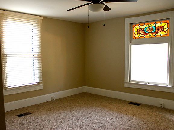 Master bedroom with original stained glass