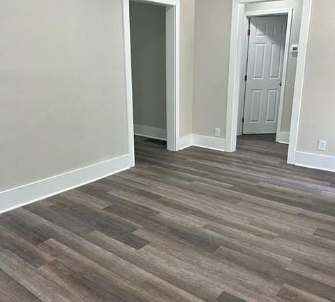 living room/ entrance to hallway in front, kitchen to the left