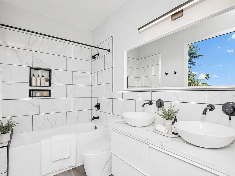 Master bathroom features his and her vanity, soaking tub