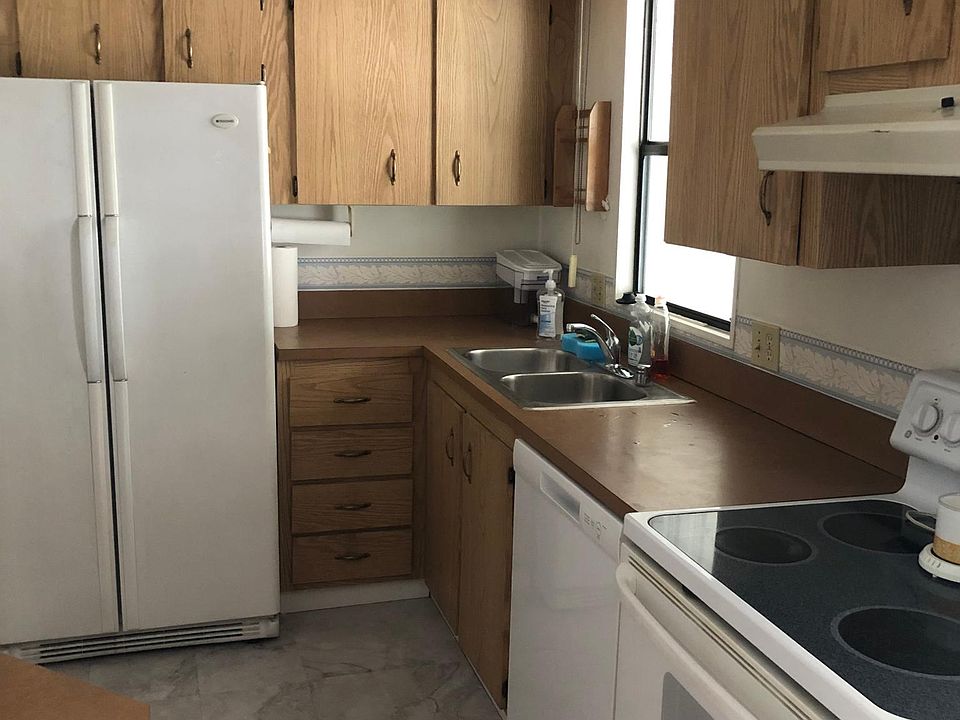 New kitchen cabinets, new floor, new dishwasher, new fridge.