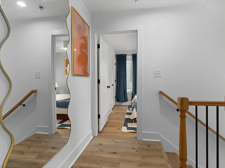 Upstairs hallway with full length mirror