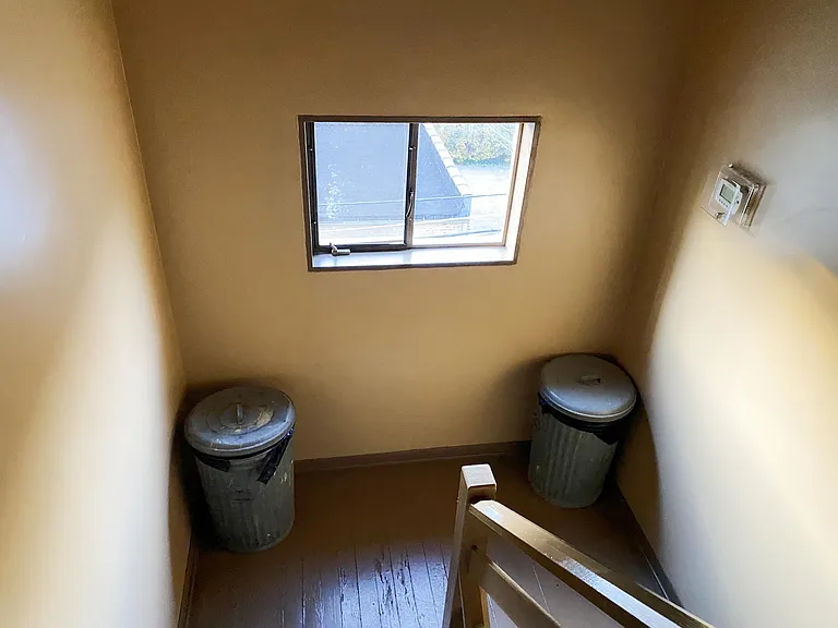 Unit-individual trash bin in the rear staircase