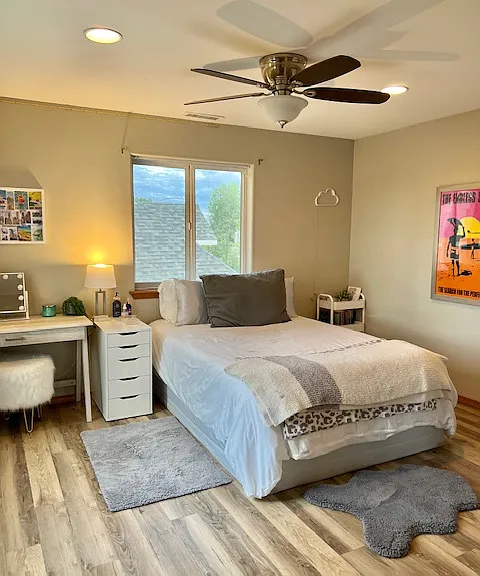 One of the upstairs bedrooms. This one has two windows and a solar screen on the pictured window.
