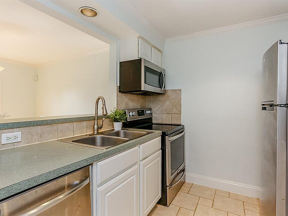 The kitchen looks out onto the dining room, which is great for entertaining guests.