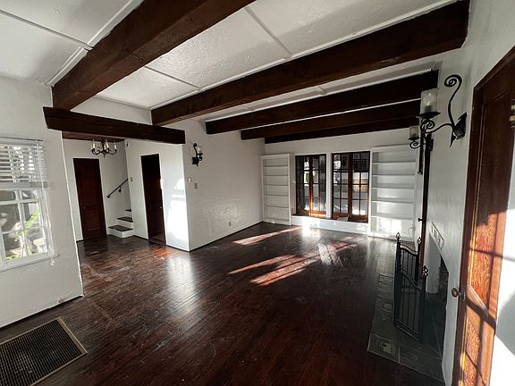 Another view of the living room, strolling a separate entrance near the staircase, along with your living room entrance.