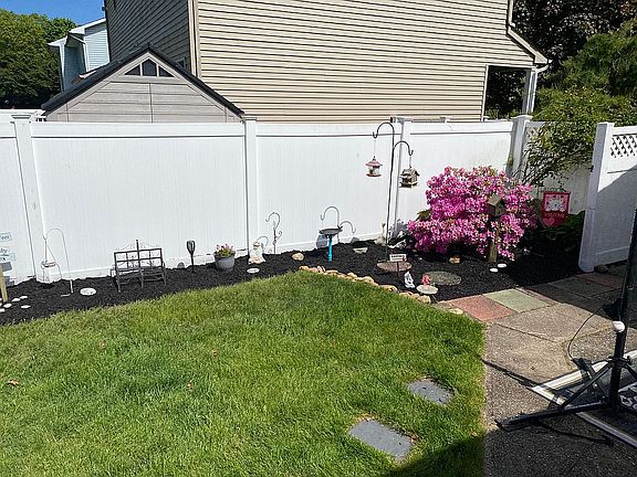 Side yard by garage 