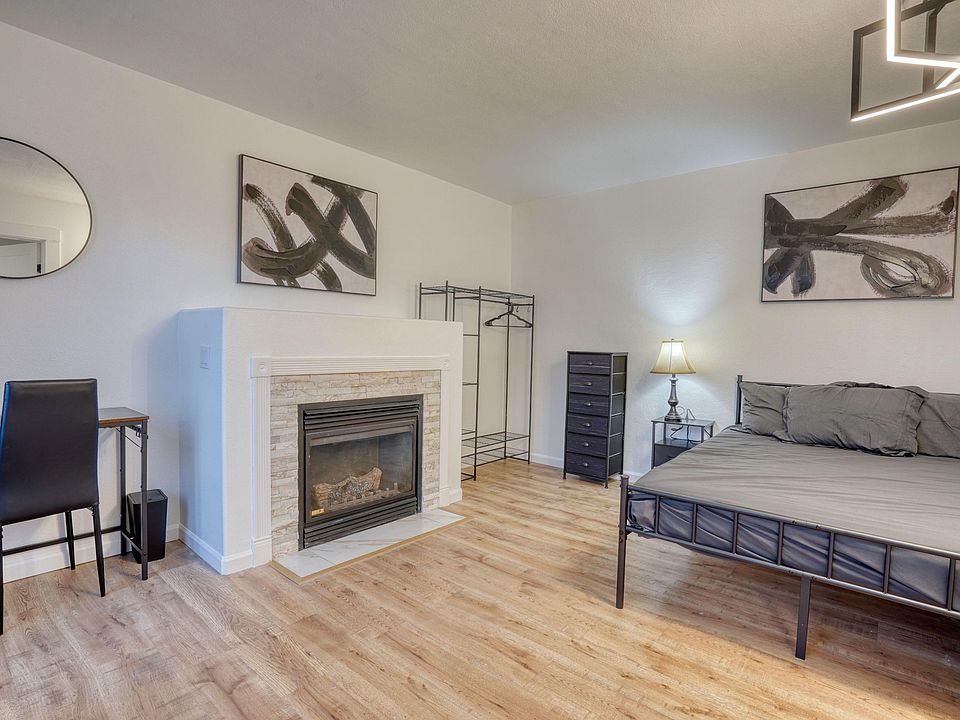 Full size bed with comfortable mattress and bedding is provided.