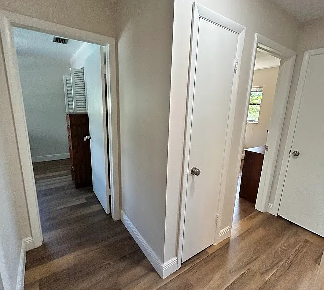 Hall between rooms, linen closet and coat closet
