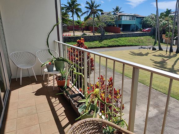 Left patio in front of the living room. Plants will be removed
