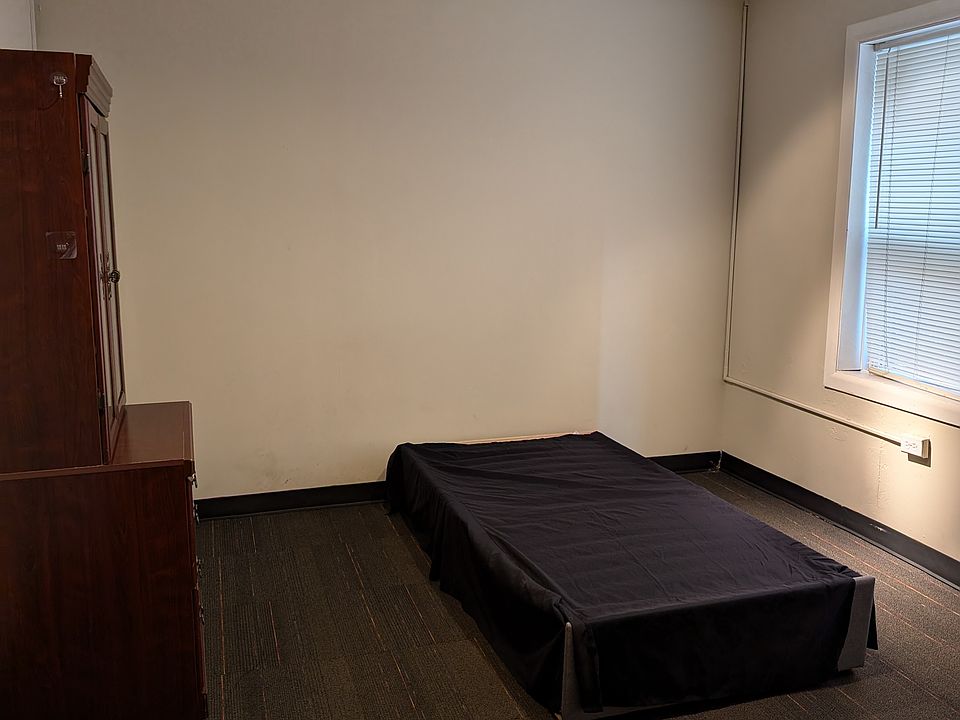 Bedroom 1 with cot and shelves and drawers - optional can be removed.