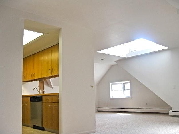 DR has dramatic Vaulted ceiling with large skylight . Counters in kitchen open to dining area for handy serving and clean-up!