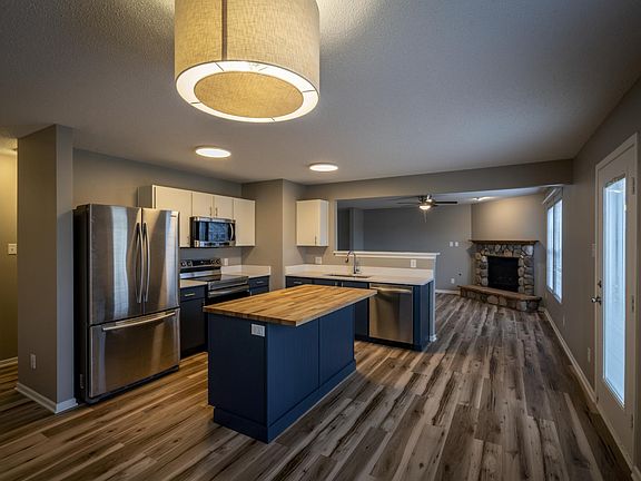 Kitchen and door to patio and fenced back yard.