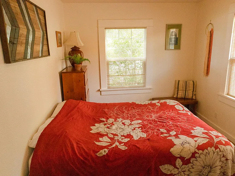 Bedroom #2 with a queen size bed, closet, and dresser for clothing/miscellaneous storage.