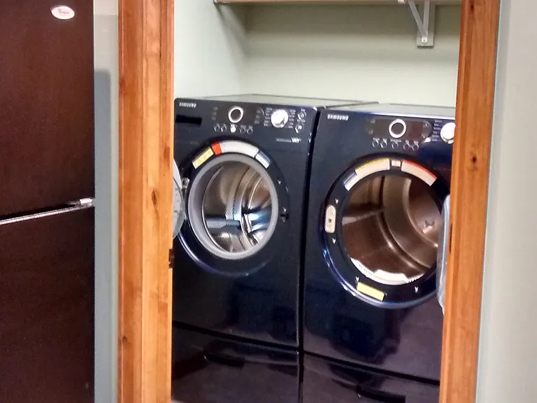 Side by side units have been replaced with new stackable W/D, creating extra storage space.