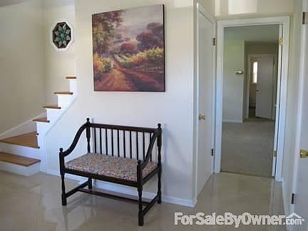 Entry Foyer
						:
						Welcome home! New tiled floor, 2 closets, access to garage