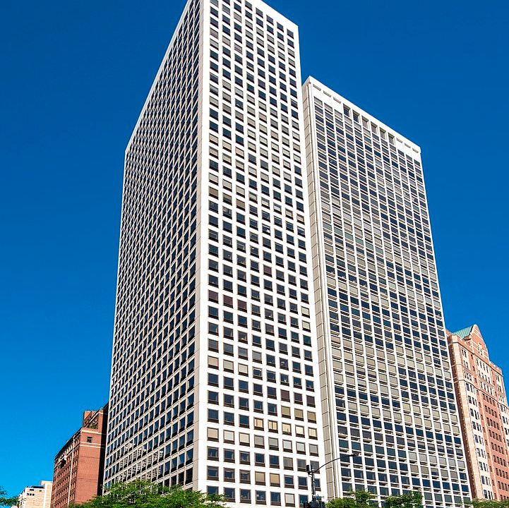 Rarely available Gold Coast corner duplexed unit on Lake Shore Drive in a boutique building with 24-