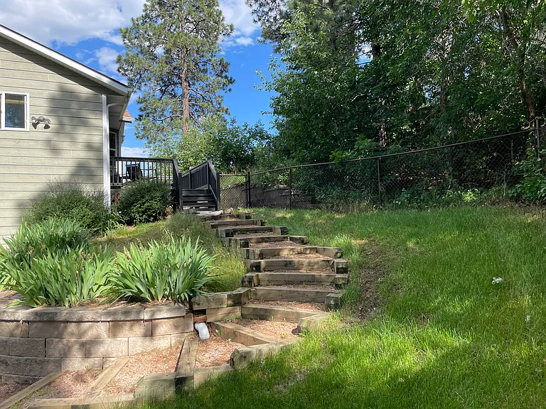 Stone stairs leading up to side deck.