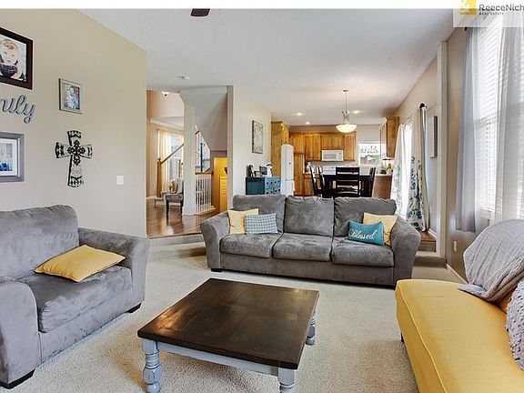 View from Fireplace toward Kitchen and eating area.  Entertain easily in this open floor plan!