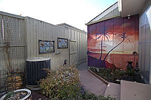 Enclosed patio with flower garden