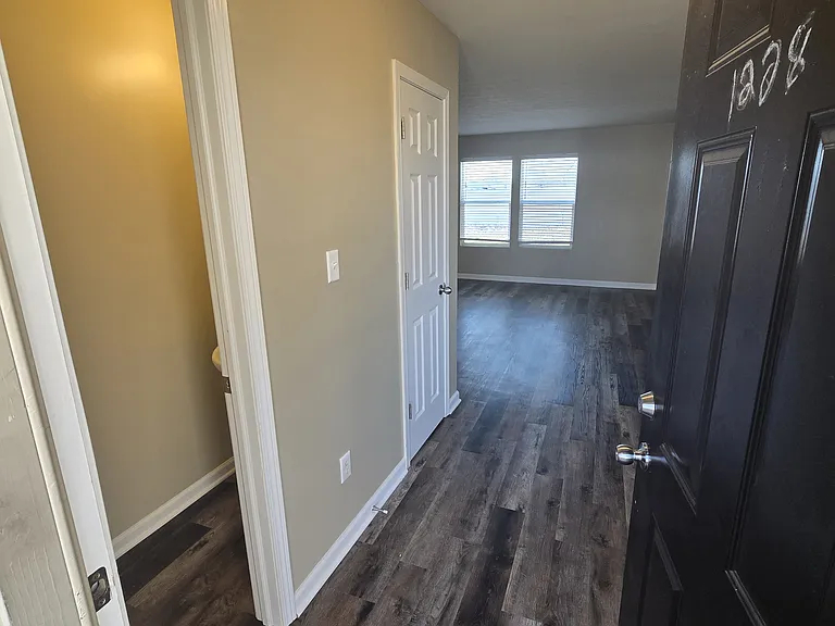 Entryway with half-bath and hall closet