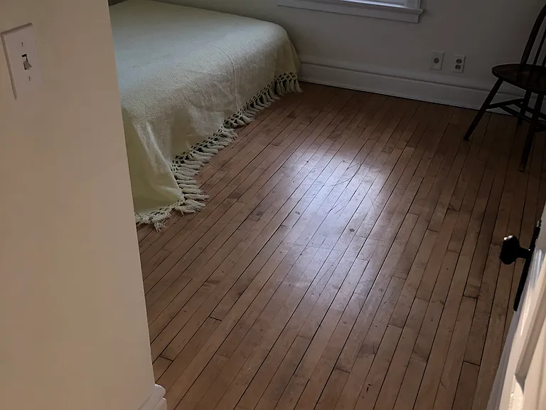 Bedroom with two windows.
Newly refinished hardwood floor.